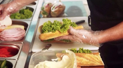 fresh baguettes being filled in a canteen