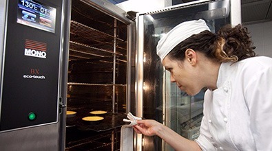 Professional Chef Loading MONO's BX Eco Touch Convection Oven with Savoury Tartlets