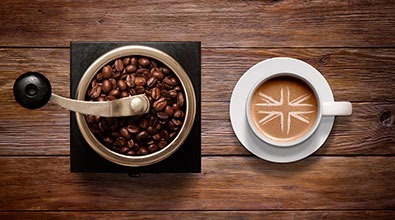Cup of coffee & coffee bean grinder